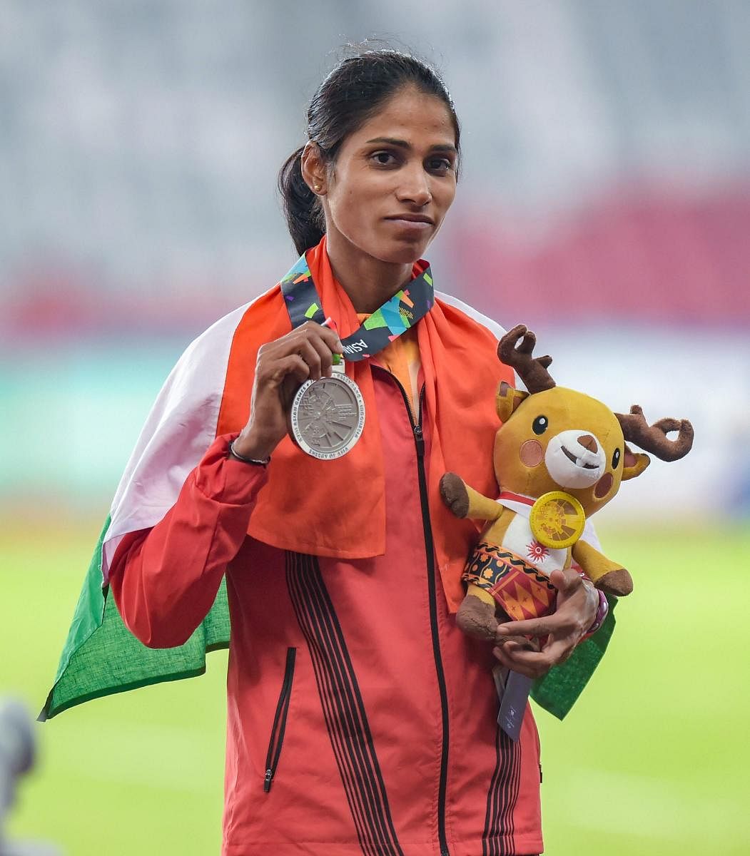 Silver medallist India's Steeplechase athlete Sudha Singh poses for photographs during the 18th Asian Games Jakarta - Palembang 2018, in Jakarta on Monday, Aug 27, 2018. (PTI Photo)