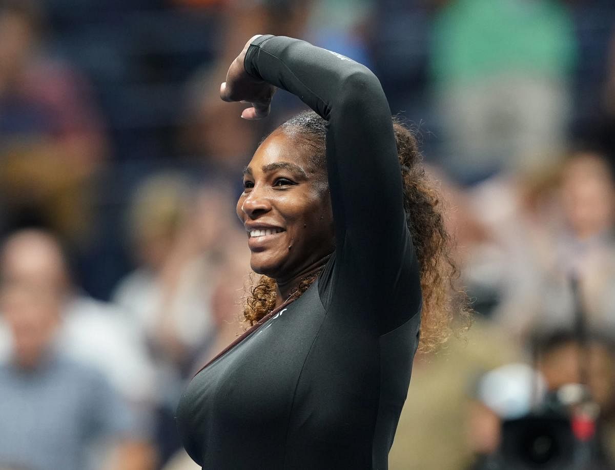 Serena Williams of the US celebrates her victory over Magda Linette of Poland during their 2018 US Open women's match August 27, 2018 in New York. - Serena Williams made a triumphant return to the US Open on Monday, opening her bid for a record-tying 24th Grand Slam title with a 6-4, 6-0 first-round victory over Magda Linette. (AFP Photo)