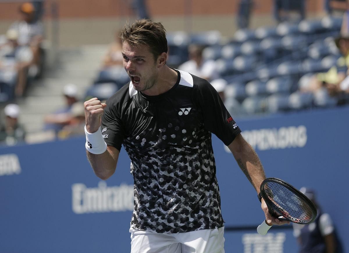 PUMPED UP: Stan Wawrinka of Switzerland reacts during his first round match against Grigor Dimitrov, of Bulgaria at the US Open on Monday. AP/PTI