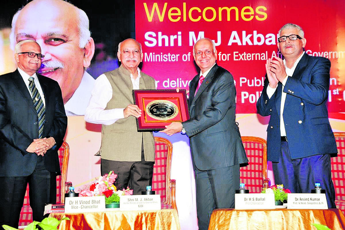 MAHE Pro Chancellor Dr H S Ballal hands over a memento to Union Minister of State for External Affairs M J Akbar at Manipal on Tuesday.