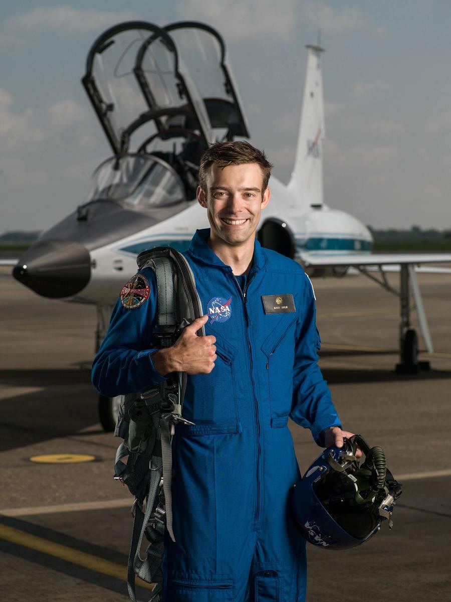 This handout photo released by NASA shows 2017 NASA Astronaut Candidate Robb Kulin on the tarmac by Hangar 276 in Ellington Field, Houston, Texas, on June 6, 2017. (Photo by Robert Markowitz - NASA - Johnso and Handout / NASA / AFP)