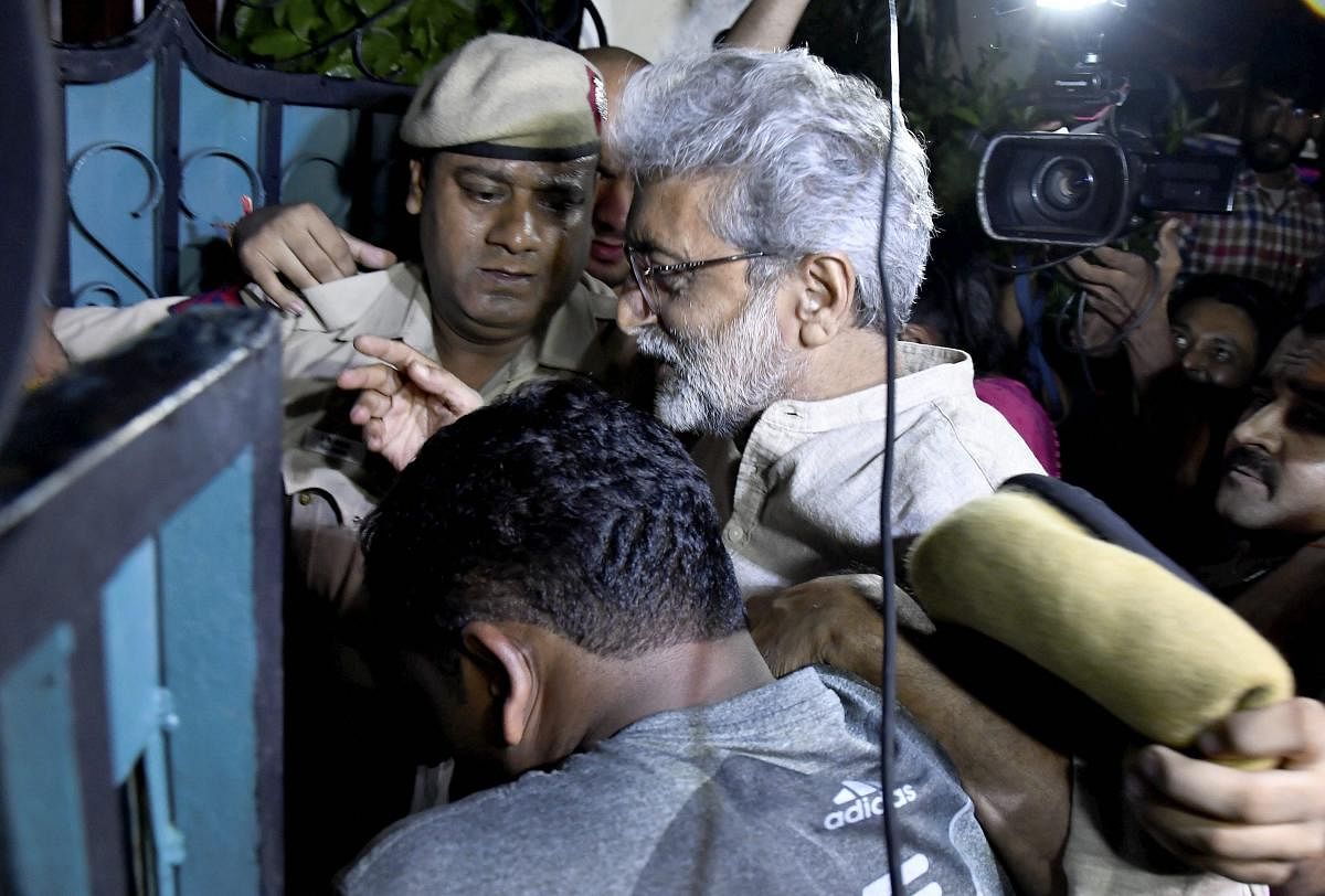 Human rights activist Gautam Navlakha at his residence after he was arrested by the Pune police in connection with the Bhima Koregaon violence, in New Delhi on Tuesday, Aug 28, 2018. PTI