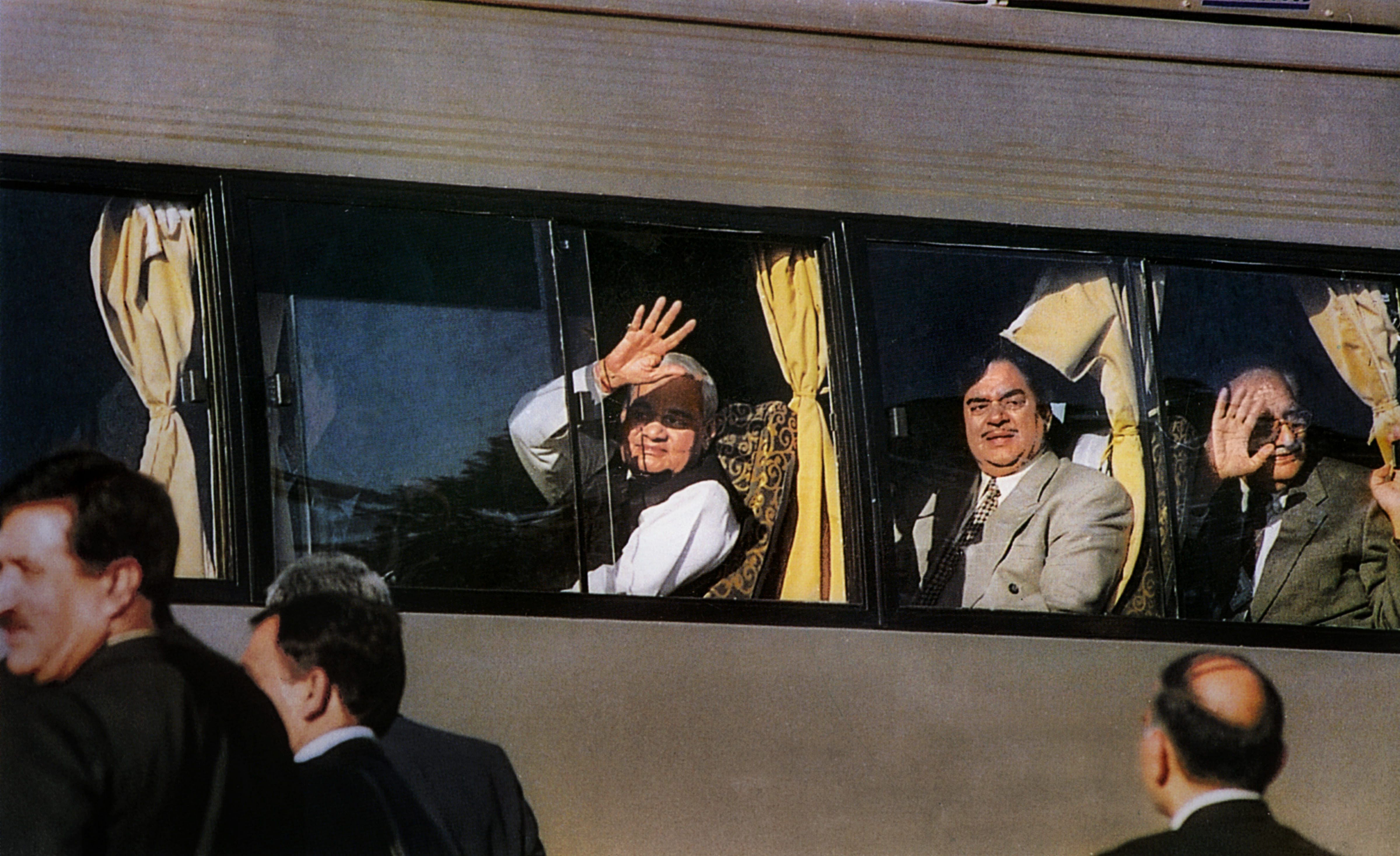 Former prime minister Atal Bihari Vajpayee waves from the maiden Delhi-Lahore bus service on his arrival at Lahore to attend a summit. (PTI File Photo)