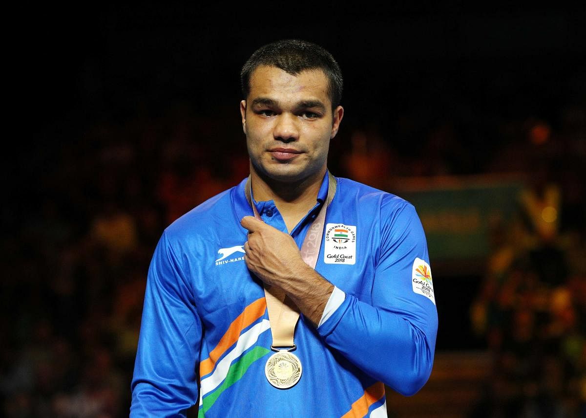 Vikas Krishan, who clinched a gold medal at the Commonwealth Games earlier this year, fought despite a cut above his left eye to beat China's Tuoheta Erbieke Tanglatihan 3-2. Reuters File photo