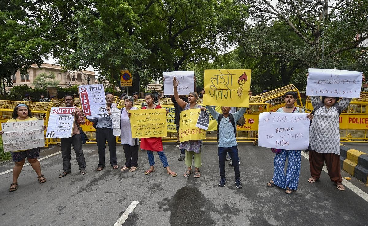 Activists from various organisations stage a protest pertaining to the arrest of five activists in connection with the Bhima-Koregaon protests, in New Delhi. PTI Photo