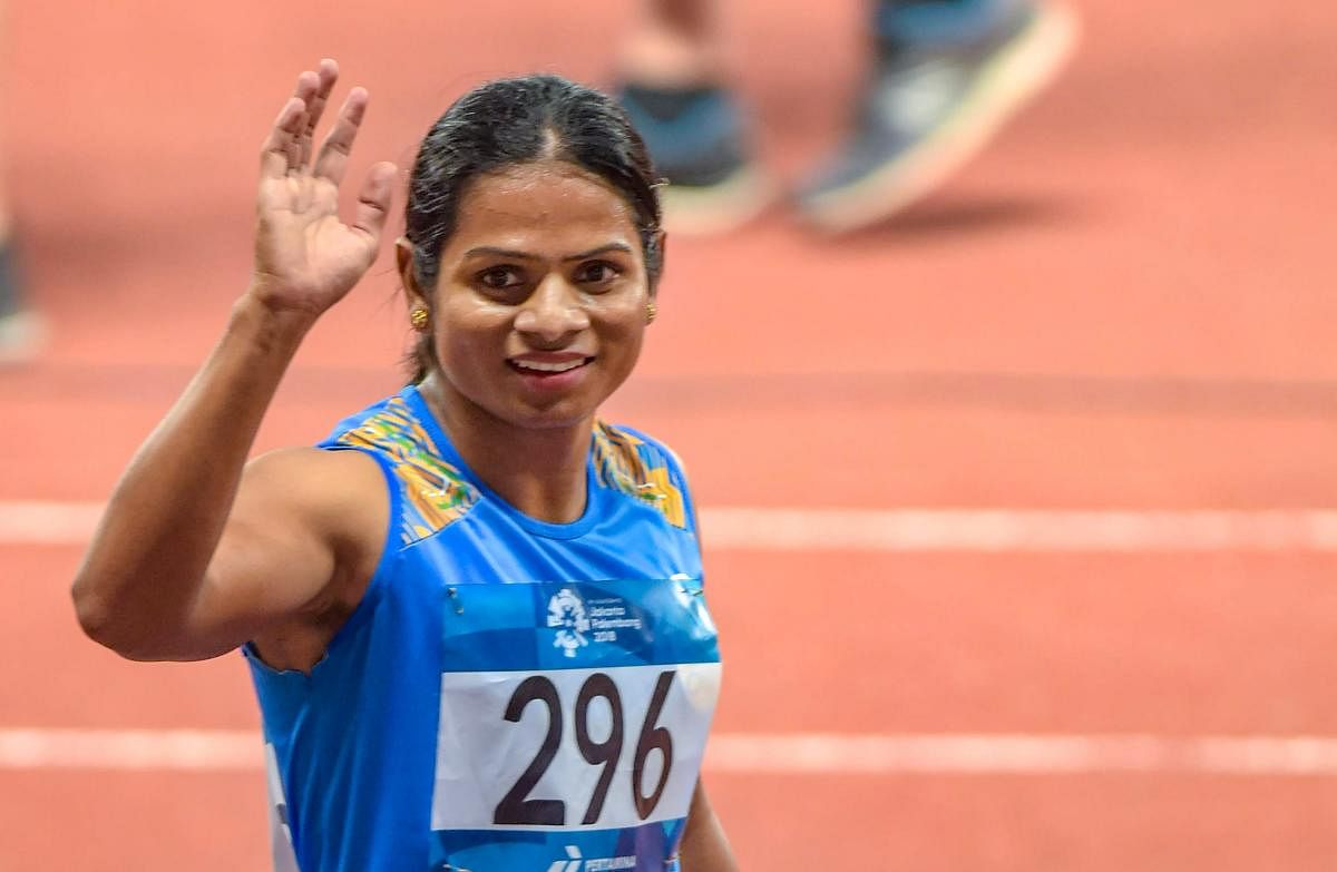 India's Dutee Chand reacts after winning the Silver medal in the women's 200m final event at the 18th Asian Games 2018 in Jakarta, Indonesia on Wednesday, Aug 29, 2018. PTI Photo