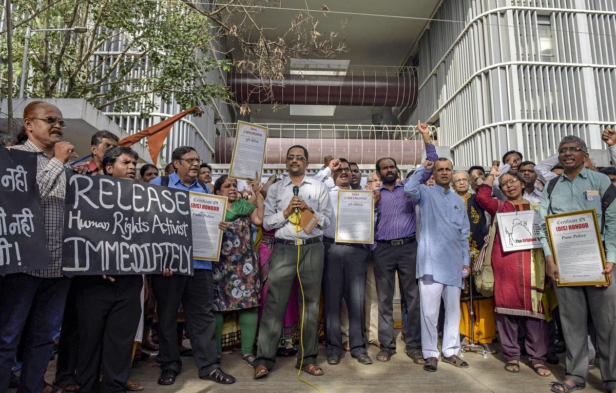 A group of activists protest against the recent arrest of 5 rights activist by the Pune Poilce, at Pune Collectorate on Thursday, August 30, 2018. (PTI Photo)