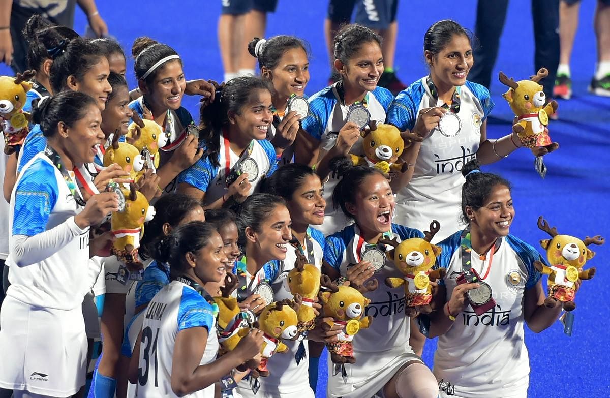 SECOND BEST: Indian women’s hockey players celebrate their silver winning effort in Jakarta on Friday. PTI