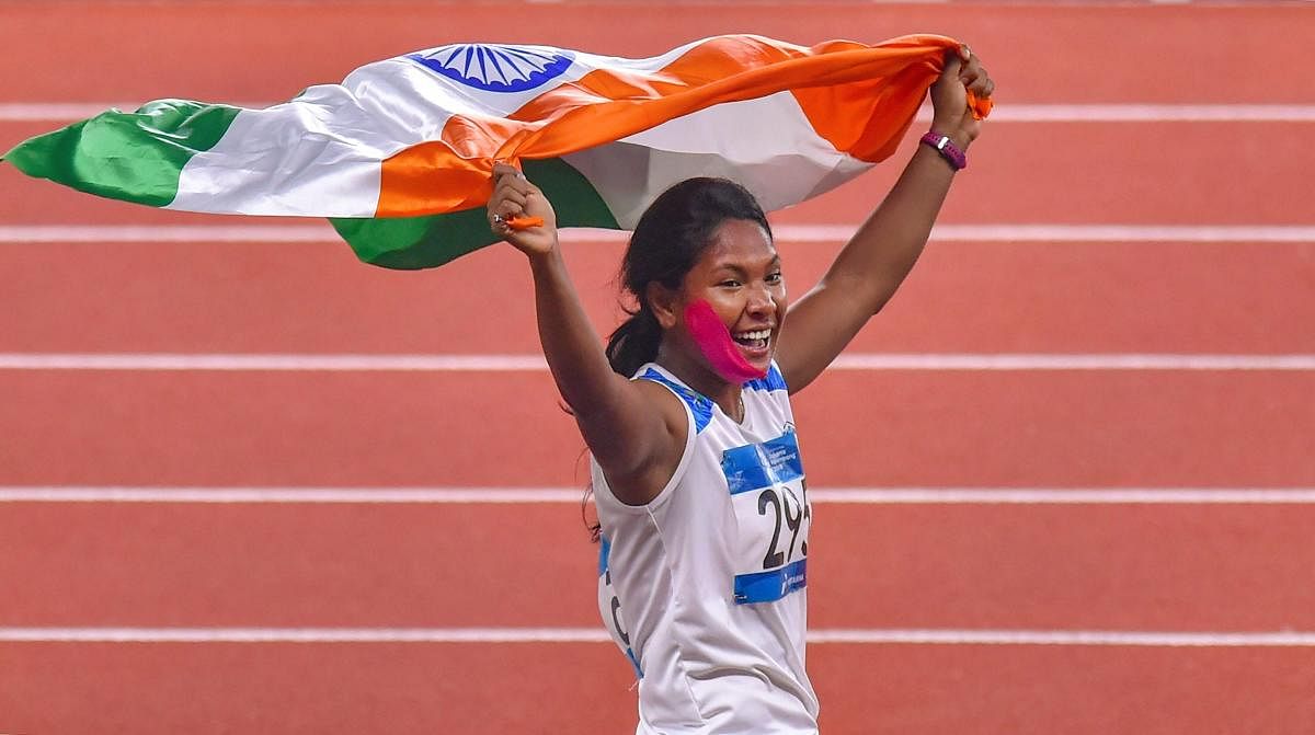 Swapna Barman celebrates after winning the gold medal in the women's Heptathlon event at the 18th Asian Games, in Jakarta, Indonesia on Wednesday, Aug 29, 2018. (PTI Photo/Shahbaz Khan)