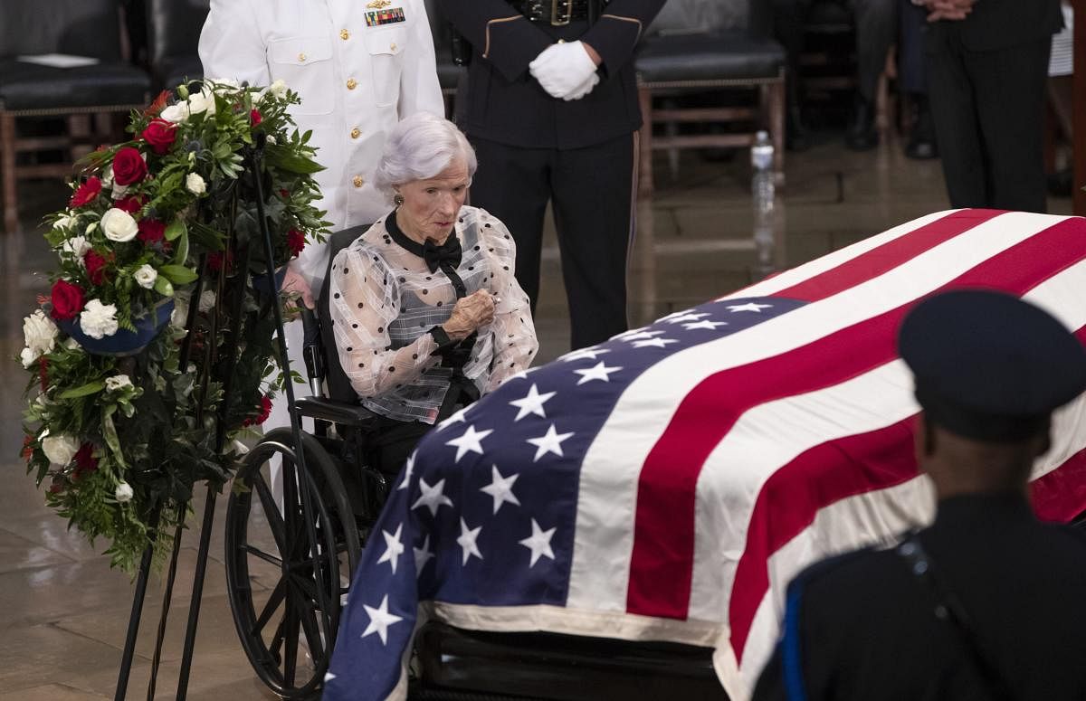 Roberta McCain, the 106-year-old mother of Sen. John McCain of Arizona, stops at his flag-draped casket in the U.S. Capitol rotunda during a farewell ceremony, Friday, Aug. 31, 2018, in Washington. (AP/PTI Photo)
