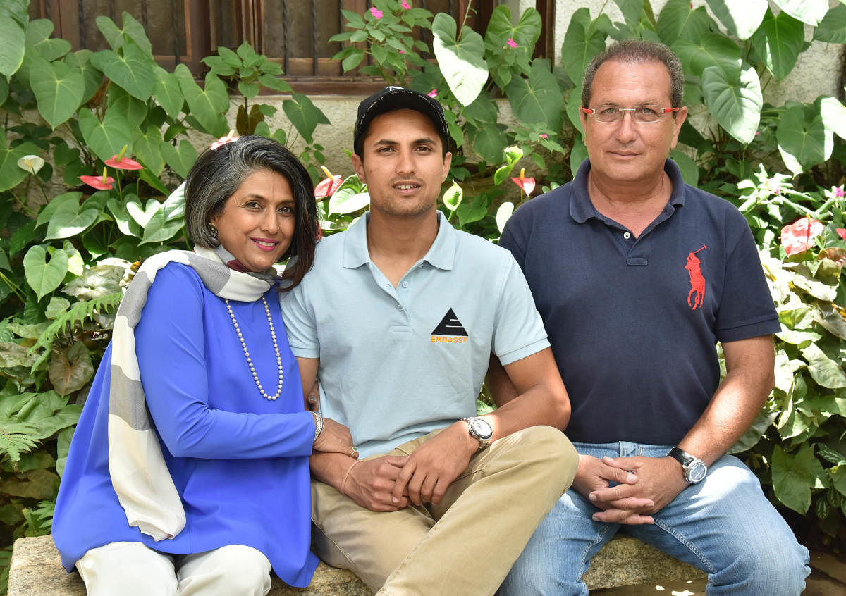 PROUD FAMILY: Asian Games double silver medallist Fouaad Mirza is flanked by his parents Indira Basapa and Dr Hasneyn Mirza at their Vasanthnagar bunglow in Bengaluru. DH PHOTO/ JANARDHAN B K 