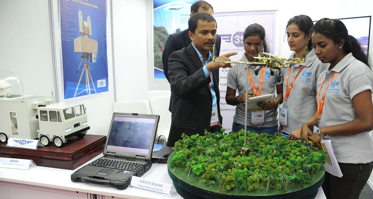 One of the start-up company team explaining on Folper Midders Poliage penetation at the Start Up tech expo 2018 at ITI limited at Dooravaninagar in Bengaluru on Saturday. (DH Photo/Srikanta Sharma R)