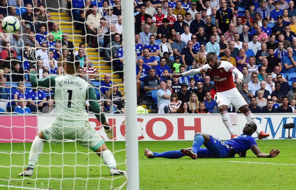 Lethal Arsenal’s Alexandre Lacazette scores his team’s third goal against Cardiff City on Sunday. REUTERS