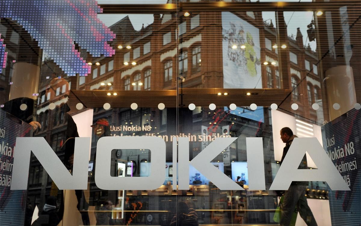 (FILES) In this file photo taken on October 21, 2010 the logo of Finland's mobile phone maker Nokia is seen on the window of Nokia flagship store in Helsinki. One and a half year after the launch of a new version of the iconic Nokia 3310, the young Finnis