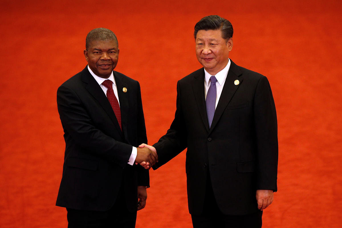 Angola's President Joao Lourenco, left, shakes hands with Chinese President Xi Jinping during the Forum on China-Africa Cooperation held at the Great Hall of the People in Beijing. Reuters photo