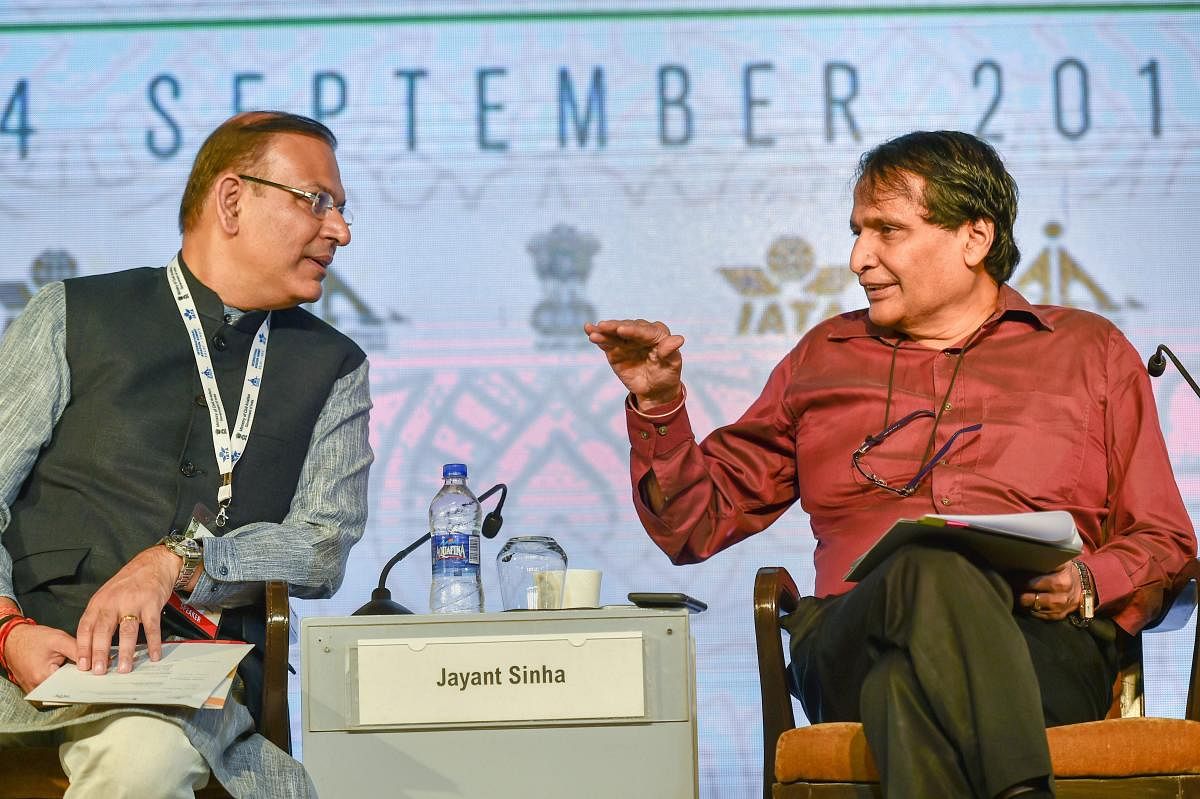 Union Civil Aviation Minister Suresh Prabhu with Minister of State Jayant Sinha at the 'International Aviation Summit: Positioning India for Global Aviation Leadership' in New Delhi. (PTI Photo)