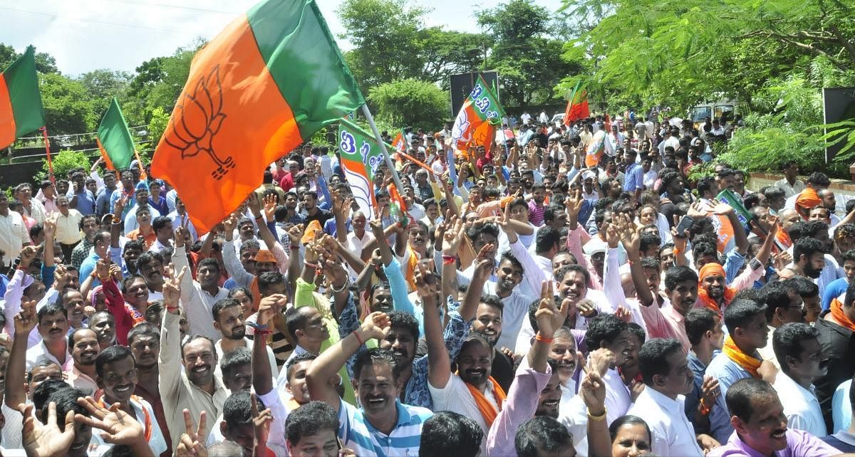 BJP workers celebrate the party's good show in the CMC elections in Udupi on Monday. DH Photo