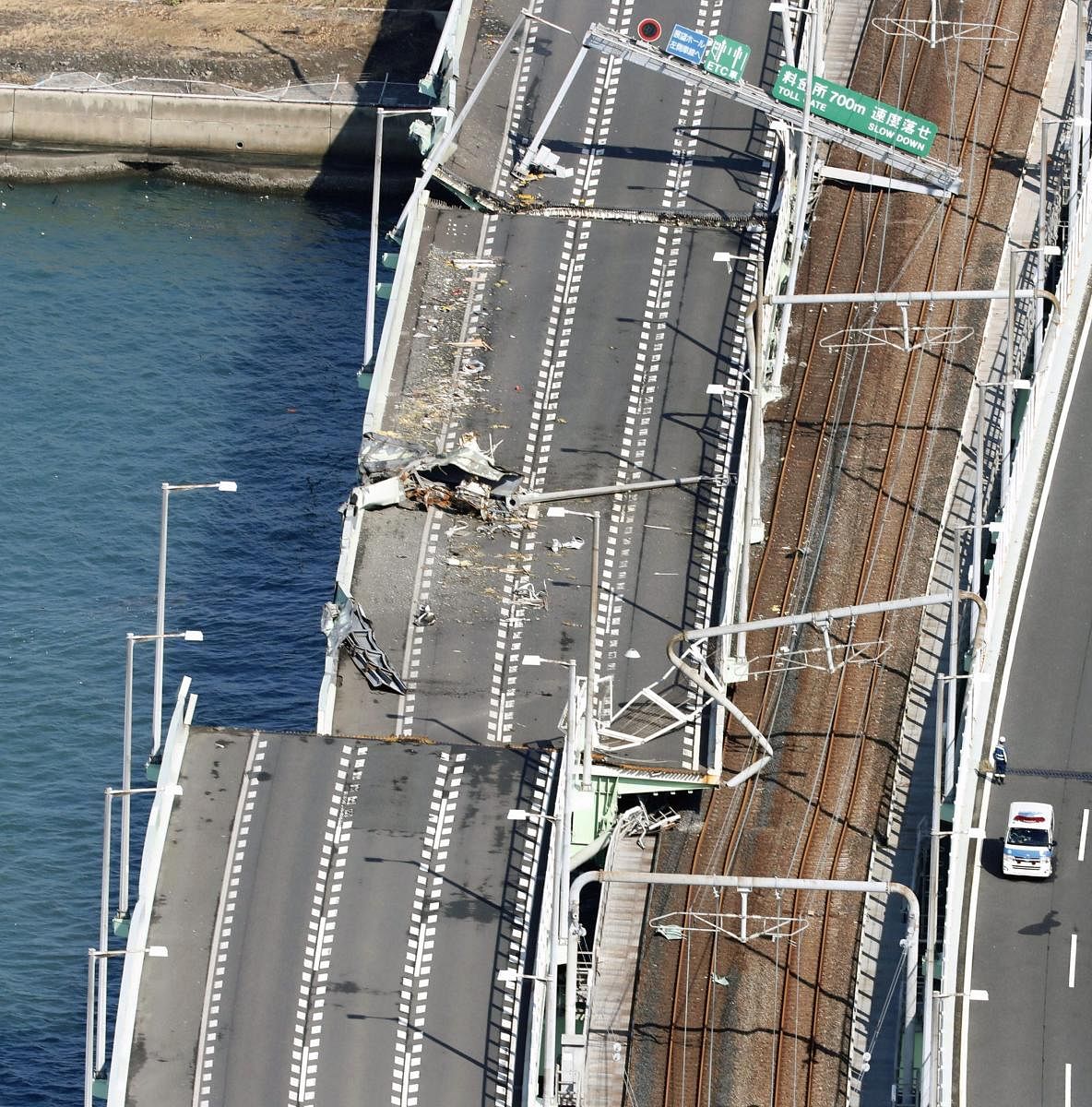 The bridge connecting Kansai International Airport in Osaka, western Japan, Wednesday, a day after a tanker slammed into its side by a powerful typhoon. About 3,000 passengers stranded by Typhoon Jebi overnight at the offshore Japanese airport begun retur