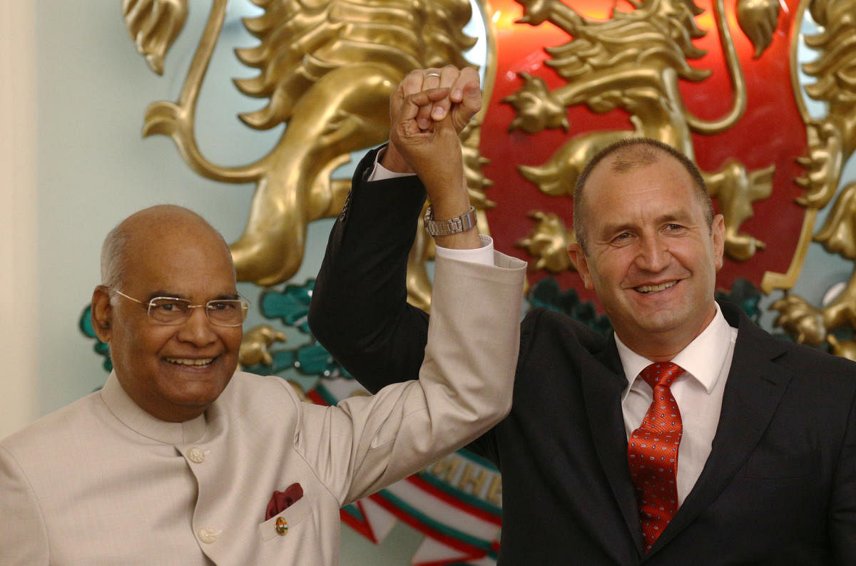 President Ram Nath Kovind and Bulgarian President Rumen Radev hold hands as the gesture during a joint news conference in Sofia, Bulgaria. Reuters Photo