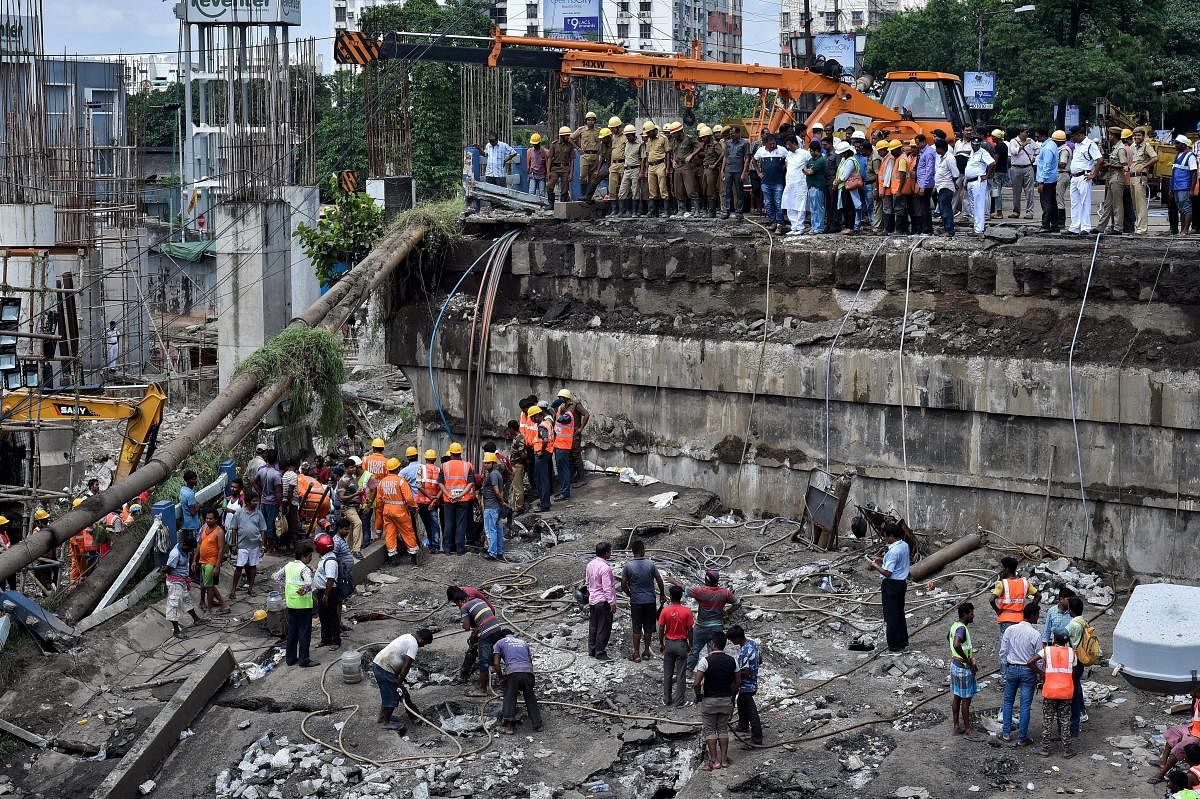 NDRF, DGM and fire personnel during the rescue operations after the collapse of Majerhat bridge, in Kolkata, Wednesday, Sept 5, 2018. (PTI Photo)