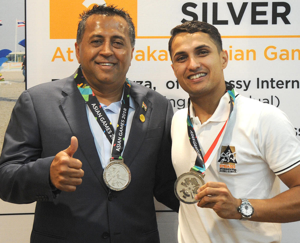 ALL SMILES Chairman and managing director of Embassy group Jitu Virwani (left) with Asian silver medalist Fouaad Mirza during a press conference on Thursday. DH Photo