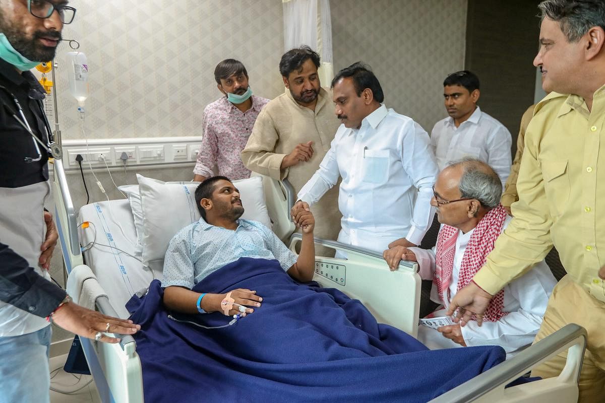 Janta Dal United's former president Sharad Yadav meets PAAS leader Hardik Patel, who has been on an indefinite hunger strike for reservation since Aug 25, in Ahmedabad. (PTI Photo)