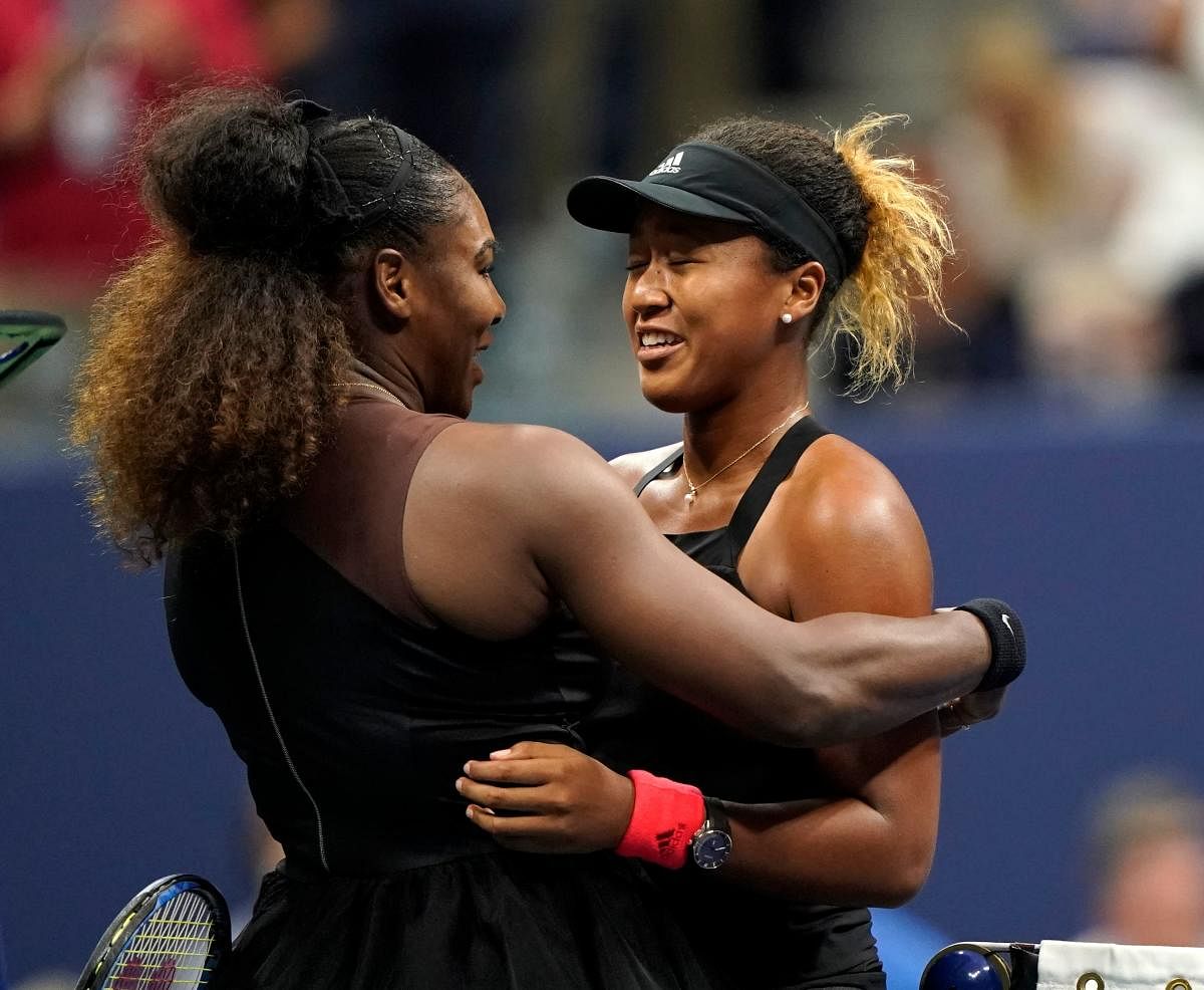 YOU DESERVED: IT Naomi Osaka of Japan (right) is being greeted by Serena Williams at the net after their final on Saturday. AFP