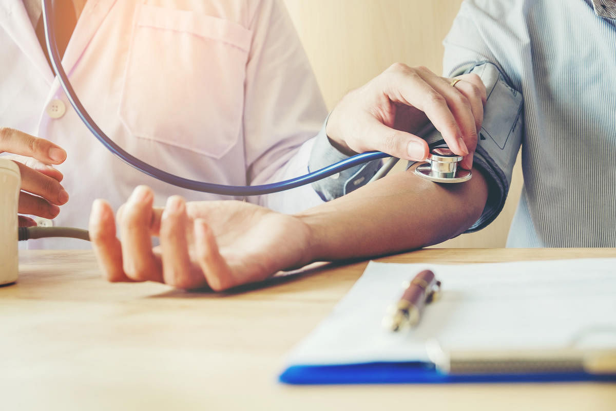 Doctor Measuring arterial blood pressure woman patient on right arm Health care in hospitalMedical tests