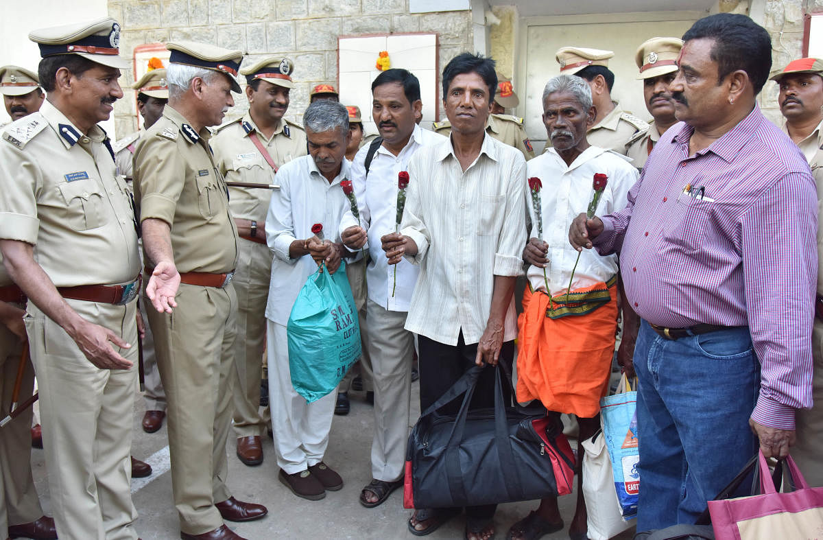 ADGP (Prisons) N S Megharikh welcomes prisoners as they walk out of the Bengaluru Central Prison on Sunday