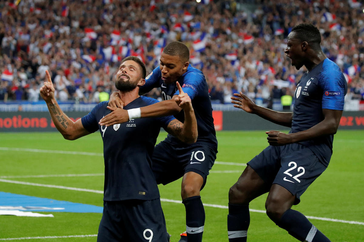DROUGHT ENDS! France's Olivier Giroud (left) celebrates with Kylian Mbappe and Benjamin Mendy after scoring the equaliser against Netherlands. Reuters 
