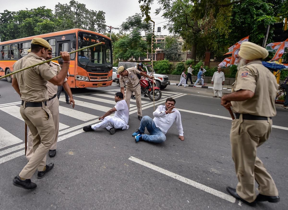 Policemen lathi-charge on members of Indian Youth Congress who were taking part in a protest march during the 'Bharat Bandh', called against fuel price hike and depreciation of the rupee, in New Delhi, Monday, Sept. 10, 2018. PTI Photo