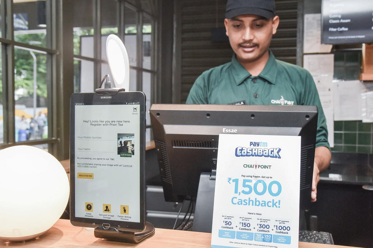 Chai Point, Church Street uses AI. The cashier does not take the customer's contact details as the device at his counter automatically recognises their face. DH Photo by S K Dinesh