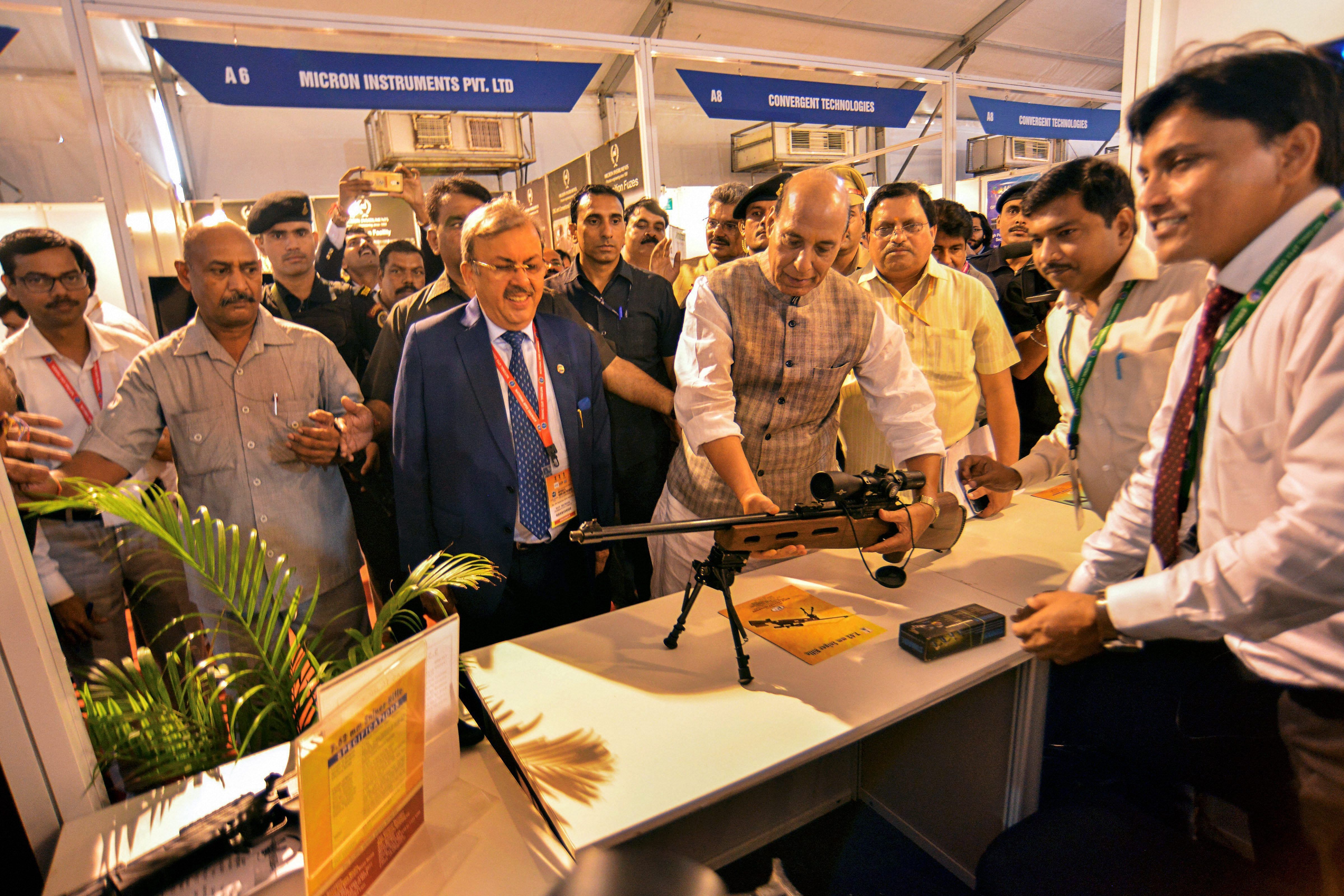 Home Minister Rajnath Singh visits a stall at 'Defence & Homeland Security Expo and Conference', in New Delhi on Thursday. PTI