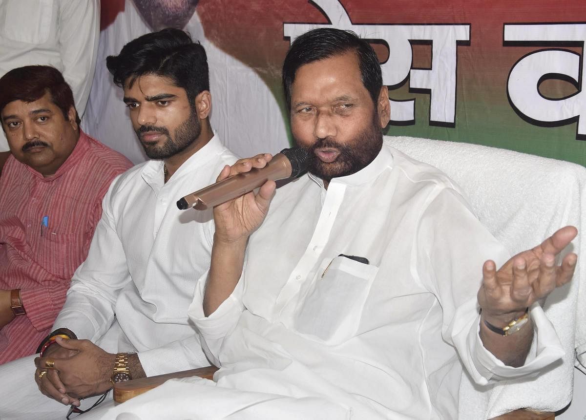 Union minister and Lok Janshakti Party chief Ram Vilas Paswan and his son Chirag during press conference at the party office in Patna. PTI File Photo