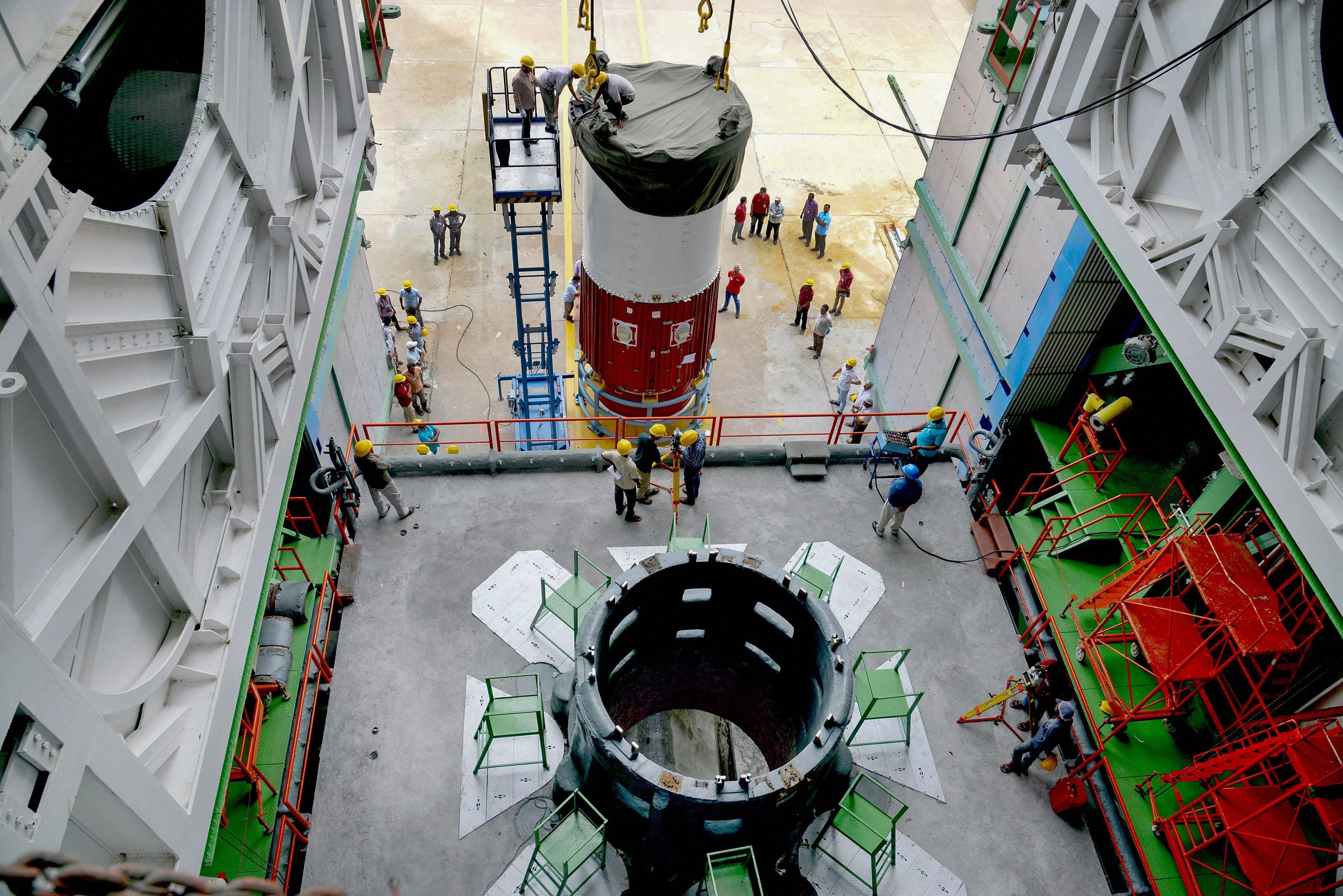 Nozzle end segment of PSLV-C42 first stage is placed over the launch pedestal as preparations are underway for the first-ever commercial launch by ISRO, of two UK satellites Novasar and S1-4, from the spaceport of Sriharikota near Chennai. PTI