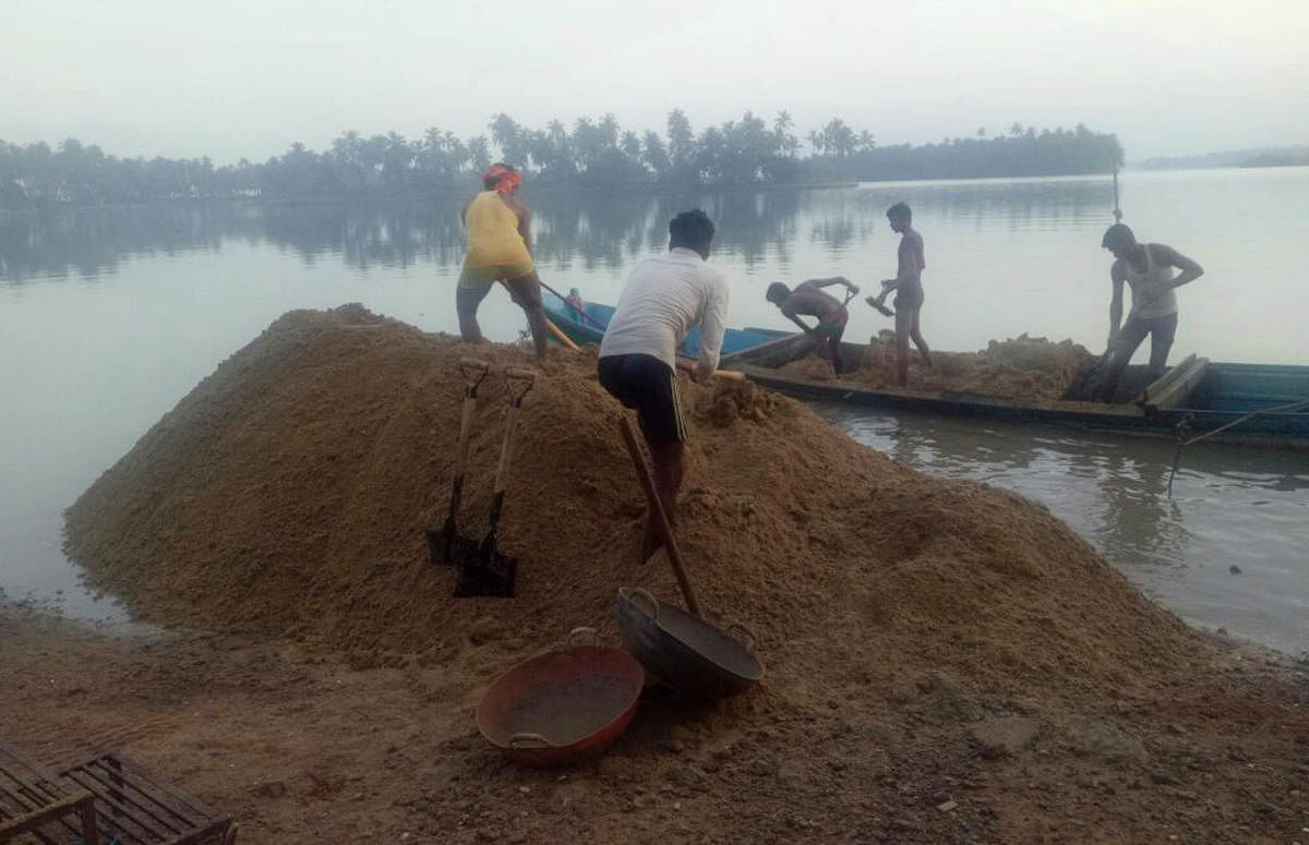 A file photo of sand being mined in the Coastal Regulation Zone in Udupi district.