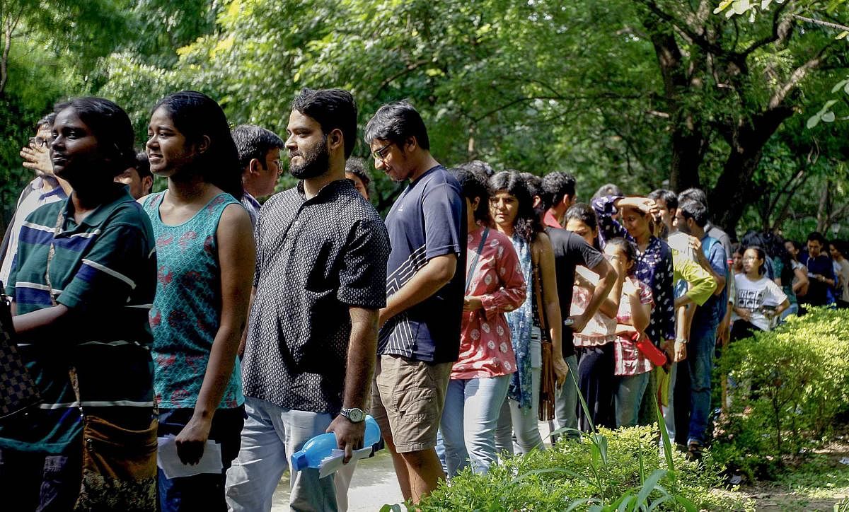 Jawaharlal Nehru University (JNU) students wait to place their votes during the students' union polls, in New Delhi, Friday, Sept 14, 2018. (PTI Photo/Ravi Choudhary)