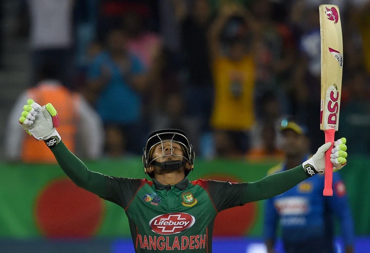 Bangladeshi batsman Mushfiqur Rahim celebrates after scoring 100 runs during the one day international (ODI) Asia Cup cricket match between Bangladesh and Sri Lanka at the Dubai International Cricket Stadium in Dubai on September 15, 2018. (AFP Photo)