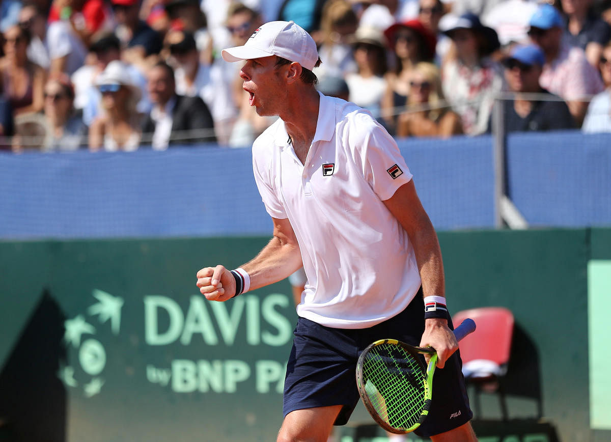 Sam Querrey of the US celebrates after winning a point against Marin Cilic of Croatia on Sunday. REUTERS