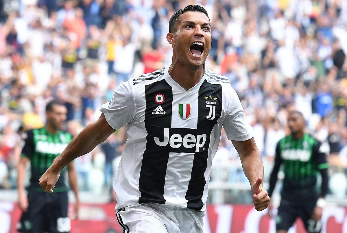 Juventus’ Cristiano Ronaldo celebrates after breaking his four-game duck against Sassuolo in Turin on Sunday. Ronaldo scored two goals as Juventus notched a 2-1 victory. AP/ PTI