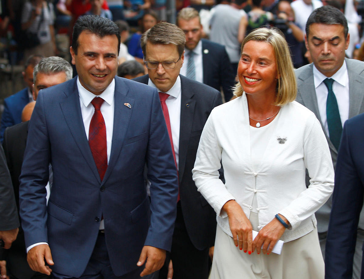 Macedonian Prime Minister Zoran Zaev and EU foreign policy chief Federica Mogherini walk through the Old Bazaar in Skopje, Macedonia September 13, 2018. Reuters