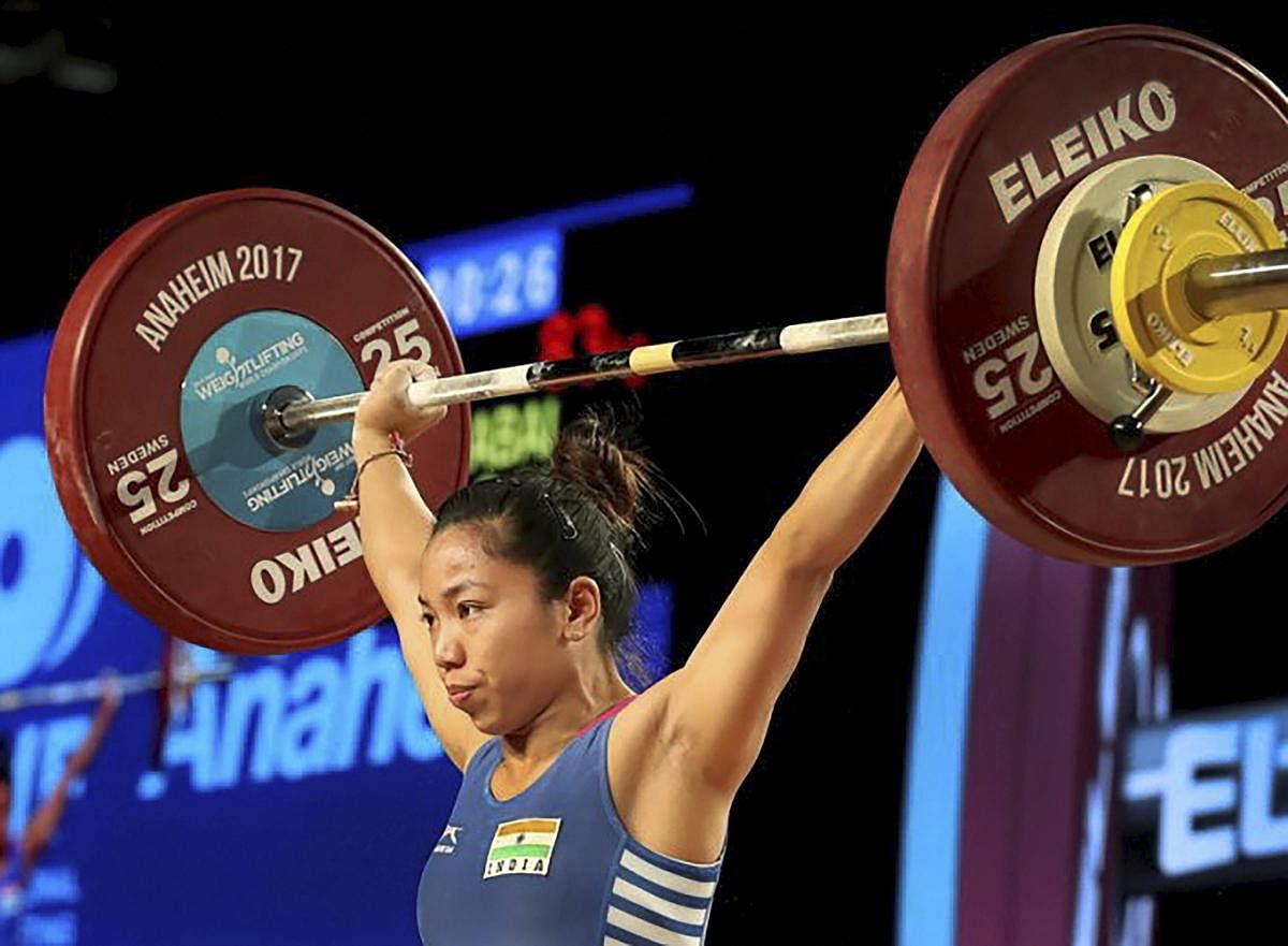 Mirabai Chanu attempts a lift on her way to win the gold medal in women’s 48kg category at the World Weightlifting Championships. PTI file photo