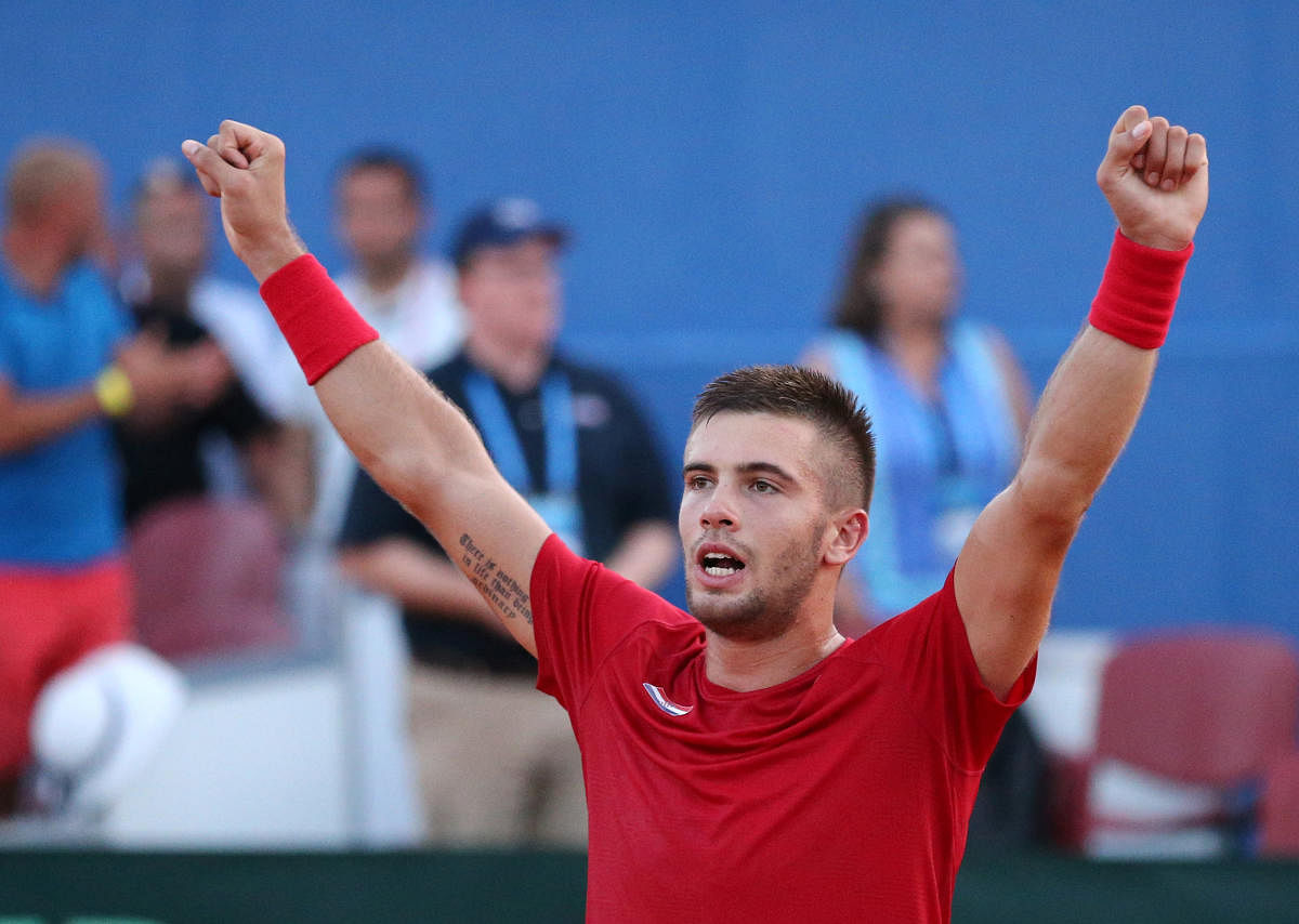 TOP GUN: Croatia’s Borna Coric celebrates after beating Frances Tiafoe of the US in the tie decider on Sunday. REUTERS