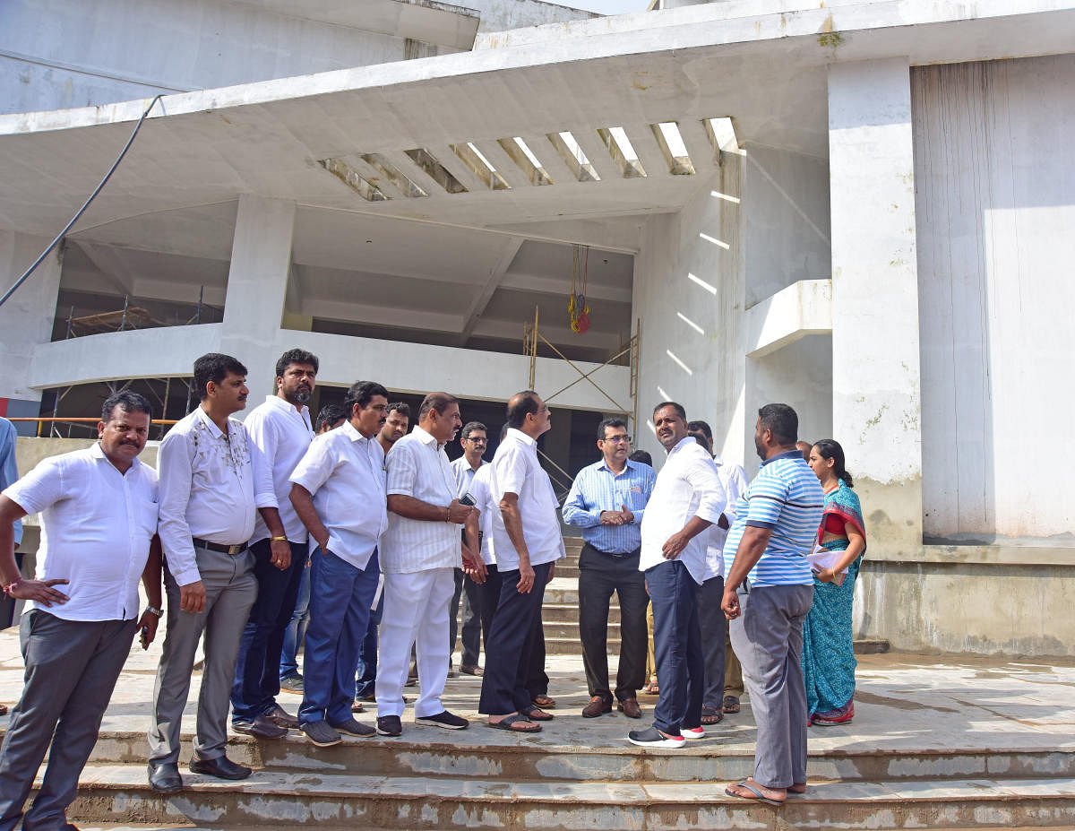 Urban Development and Housing and District in-charge minister U T Khader inspects the work at the new market complex in Urwa junction, Mangaluru, on Monday.