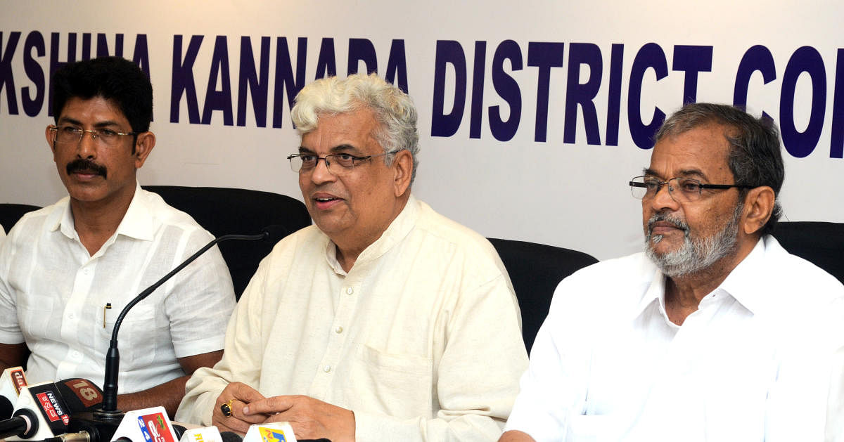KPCC Vice President Prof Radhakrishna addresses a press meet in Mangaluru on Monday. 