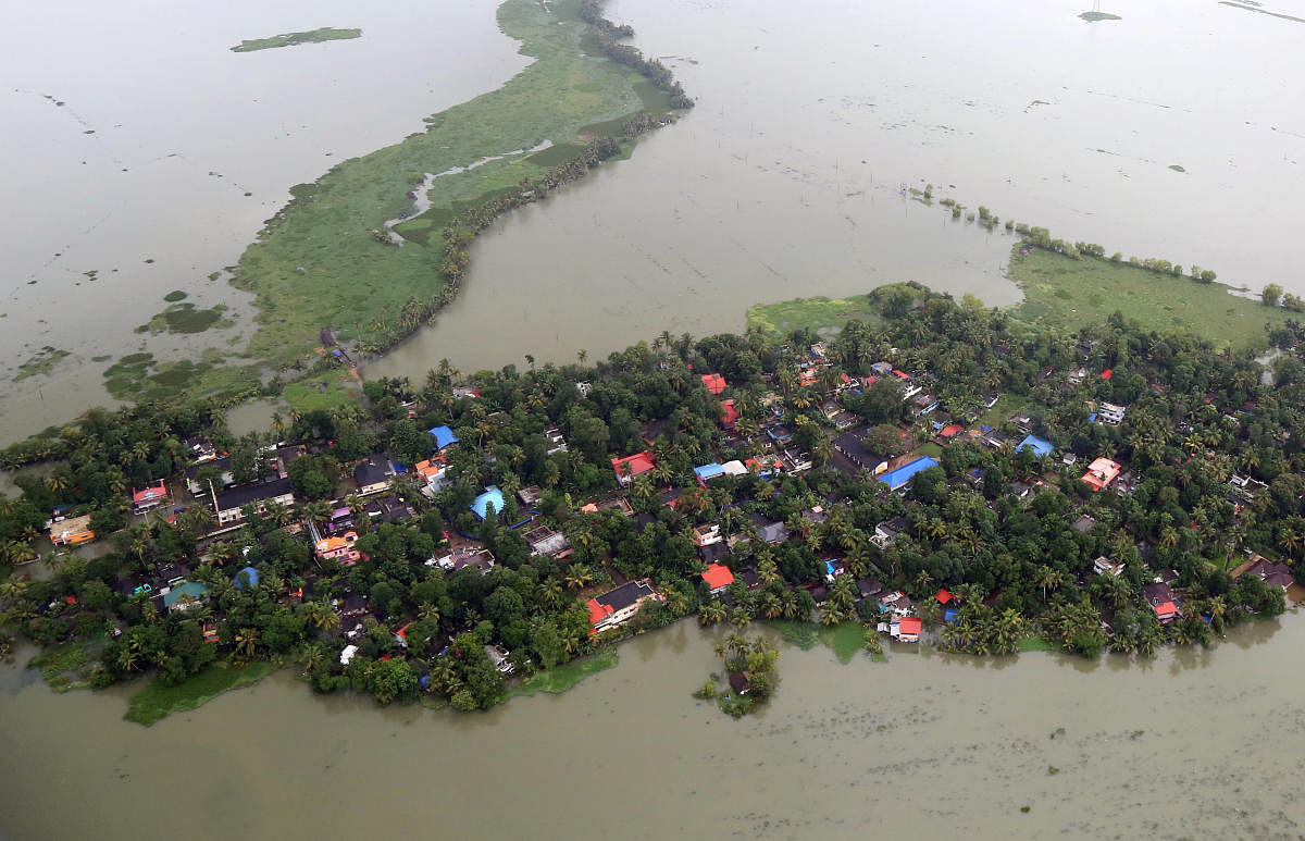 An aerial view shows partially submerged houses at a flooded area in Kerala. REUTERS