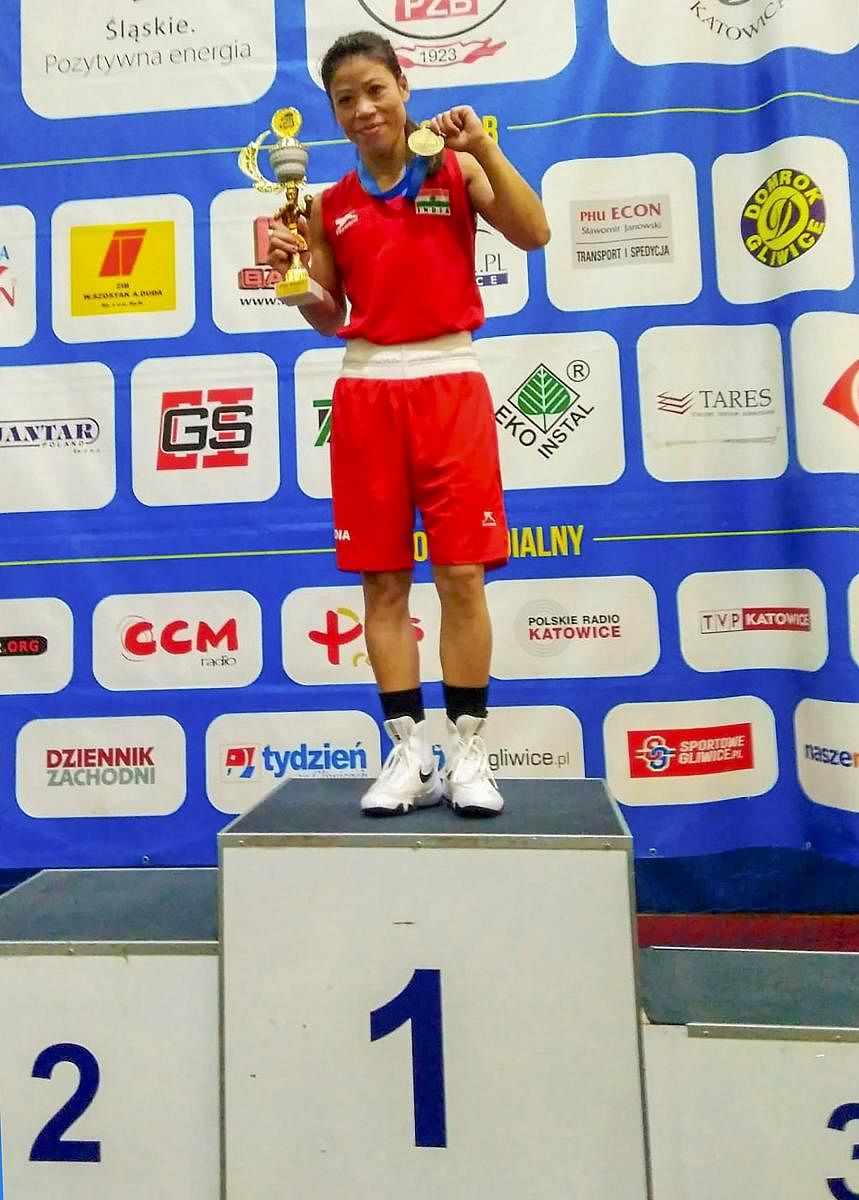 Mary Kom with her gold medal in Gliwice, Poland, on Sunday. PTI