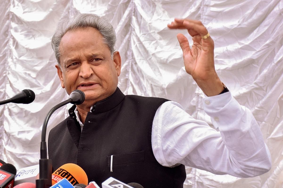 Congress general secretary and former chief minister of Rajasthan Ashok Gehlot addresses a press conference at his residence, in Jaipur, on Monday. PTI