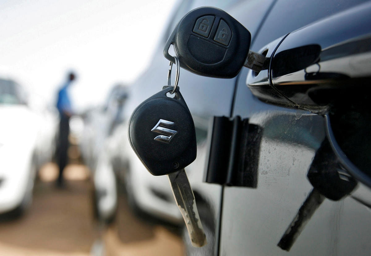 FILE PHOTO: Keys hang from the door of a Maruti Suzuki Swift car at its stockyard on the outskirts of Ahmedabad. Reuters