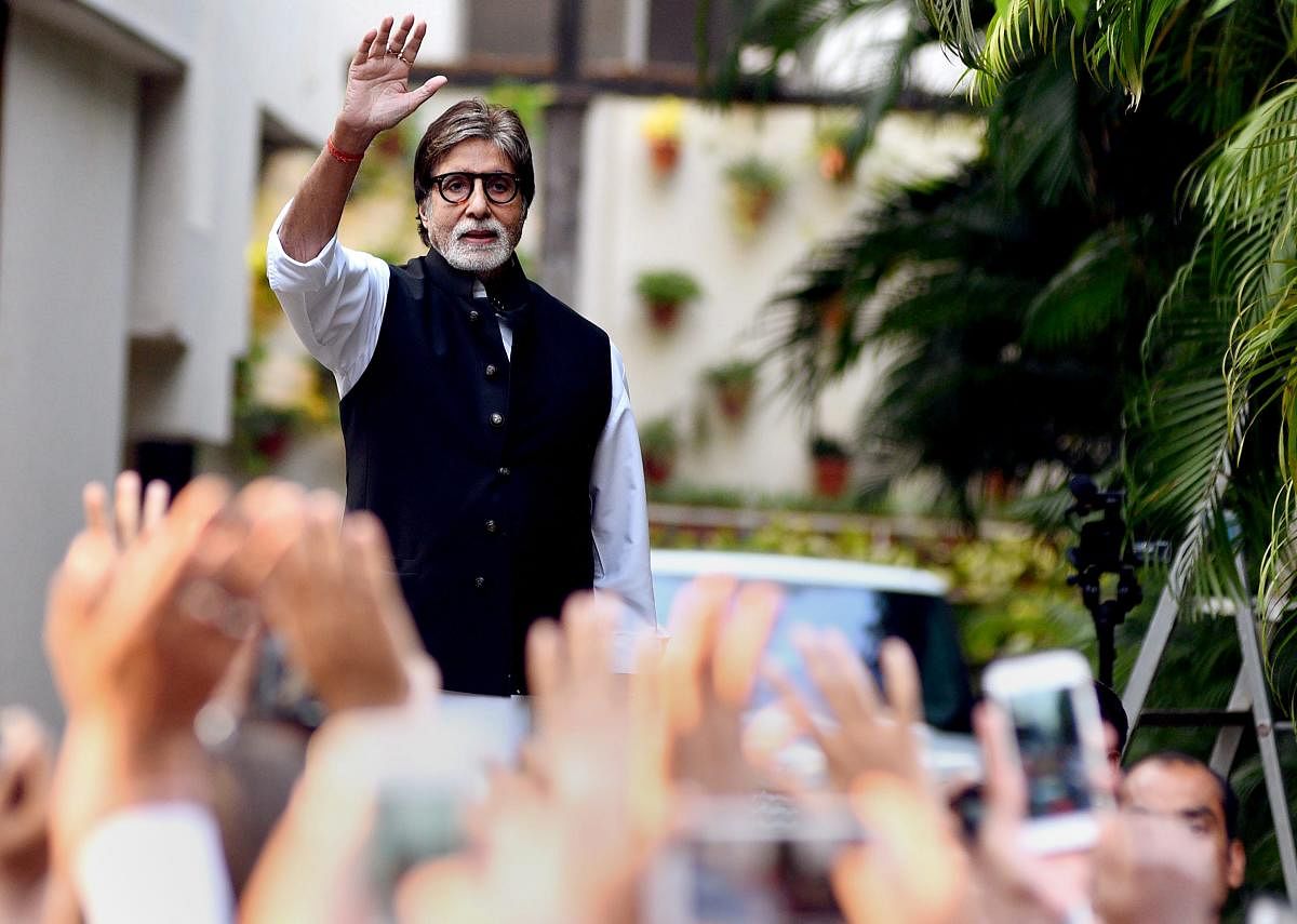 Amitabh Bachchan waves to his fans at his residence in Mumbai. PTI File Photo